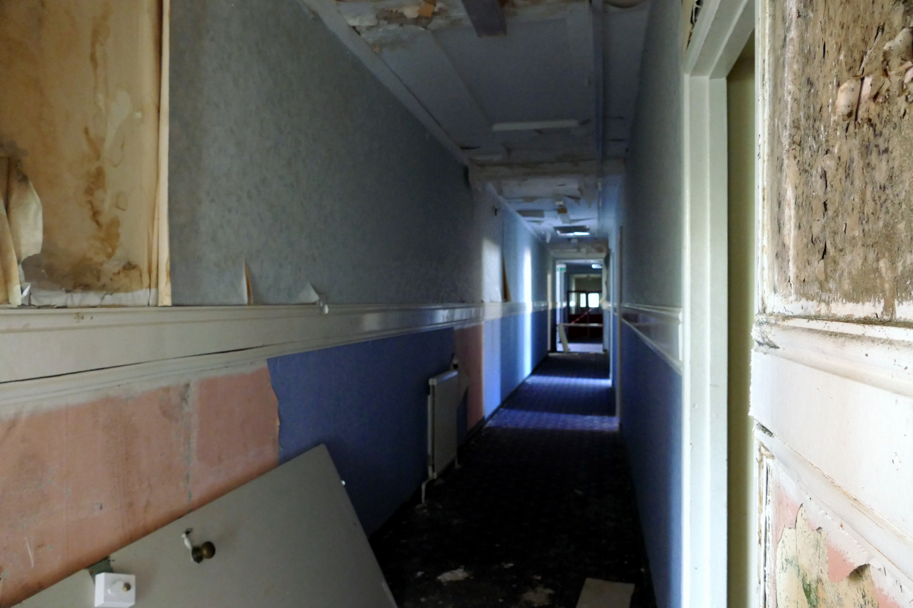 Interior of decrepit, dark and spooky corridor in Sergeants' Mess